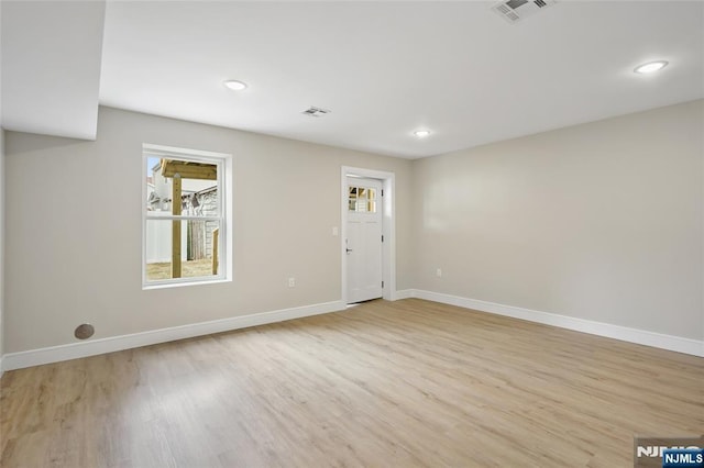 interior space with visible vents, recessed lighting, light wood-type flooring, and baseboards