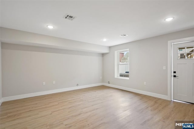 interior space featuring light wood-style flooring, recessed lighting, baseboards, and visible vents