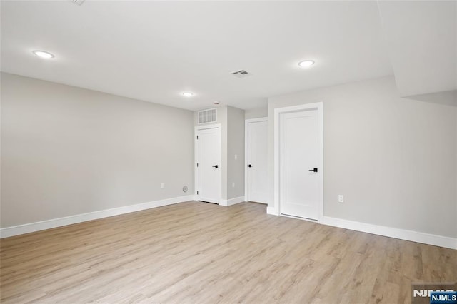 interior space featuring recessed lighting, visible vents, baseboards, and light wood-style floors