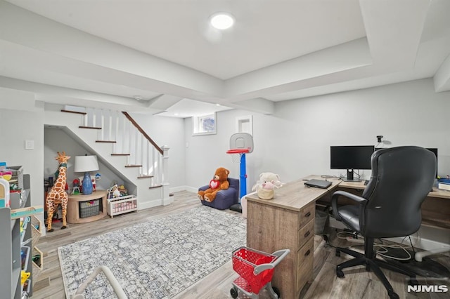 office featuring baseboards and wood finished floors