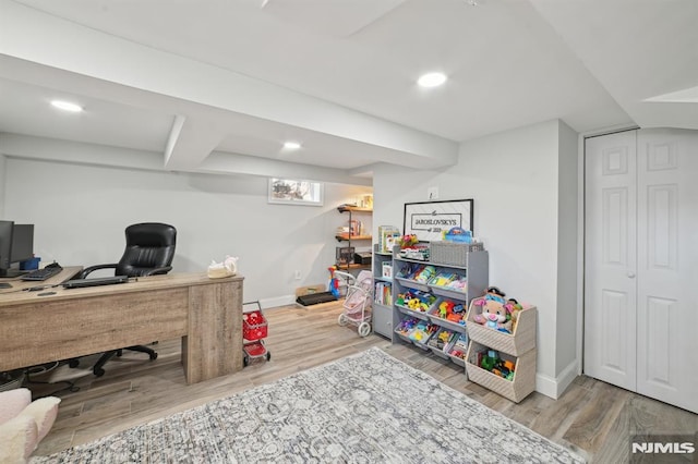 office with recessed lighting, wood finished floors, and baseboards