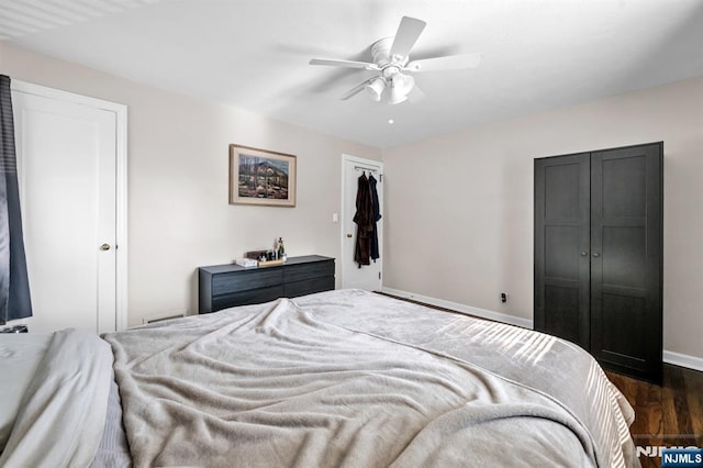 bedroom with wood finished floors, baseboards, and ceiling fan