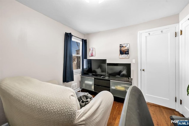 bedroom with wood finished floors