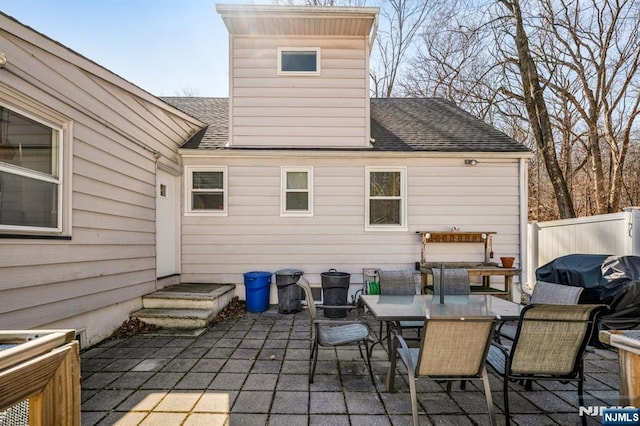 view of patio featuring outdoor dining space and fence