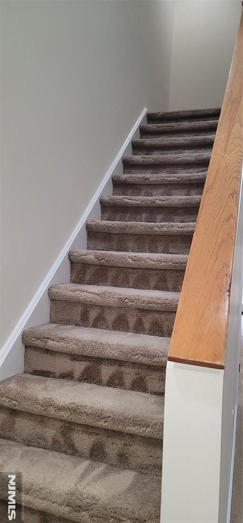 stairs featuring baseboards