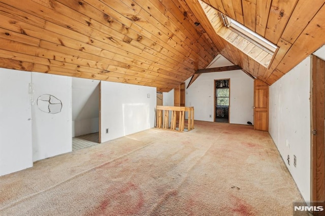 bonus room featuring vaulted ceiling with skylight, wood ceiling, and carpet flooring