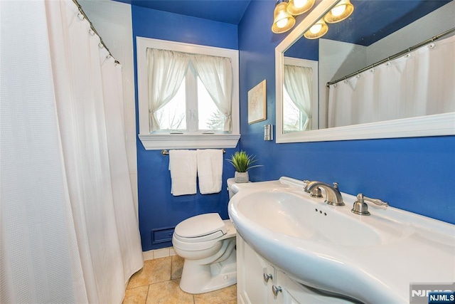 full bathroom with tile patterned floors, toilet, and vanity