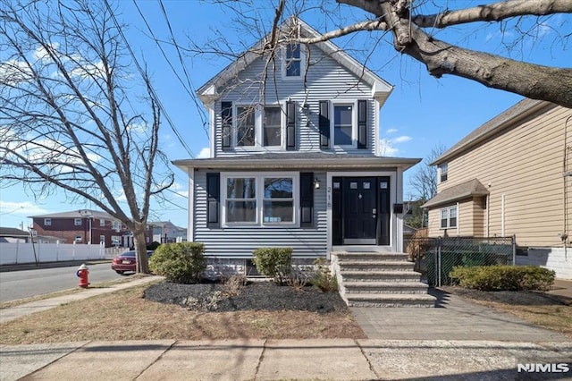 view of front of house with fence