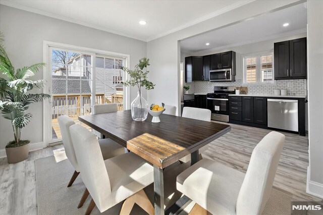 dining space featuring recessed lighting, baseboards, and ornamental molding