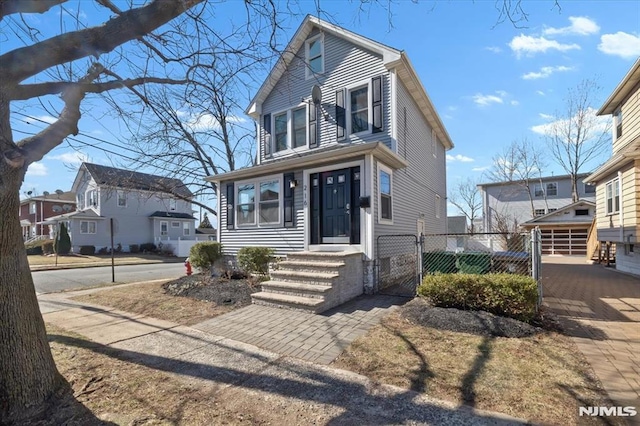 view of front of property with a gate and fence