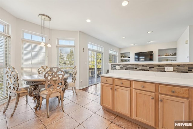 kitchen with light countertops, recessed lighting, backsplash, and light brown cabinetry