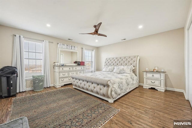 bedroom with visible vents, recessed lighting, baseboards, and wood finished floors