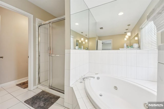 bathroom featuring tile patterned floors, visible vents, a stall shower, and a jetted tub