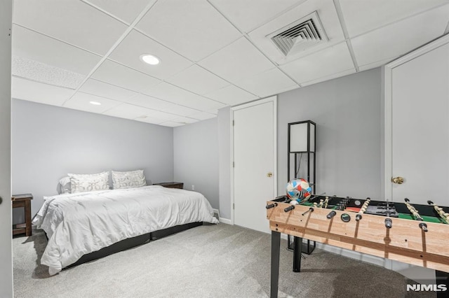 carpeted bedroom featuring visible vents, recessed lighting, and a paneled ceiling