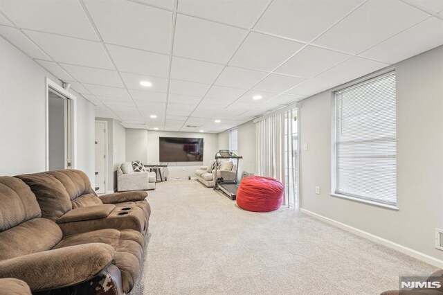 carpeted living room with recessed lighting, a drop ceiling, and baseboards