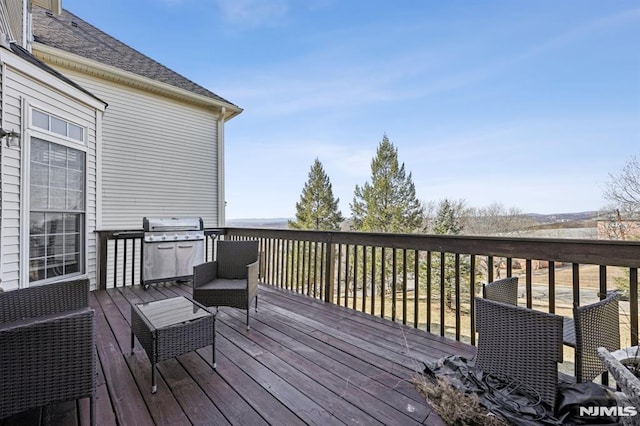 wooden terrace with grilling area