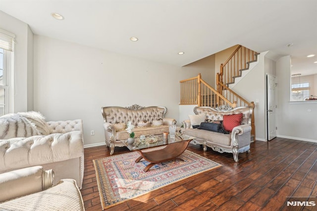 living area with stairway, recessed lighting, wood finished floors, and baseboards