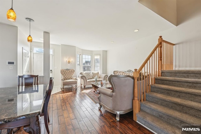 living area featuring recessed lighting, stairs, and dark wood-style flooring