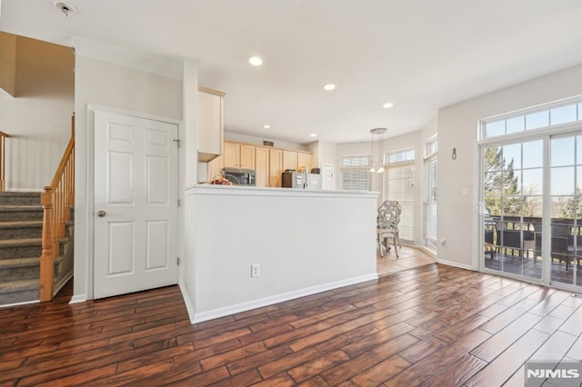 unfurnished living room with stairs, dark wood-type flooring, recessed lighting, and baseboards