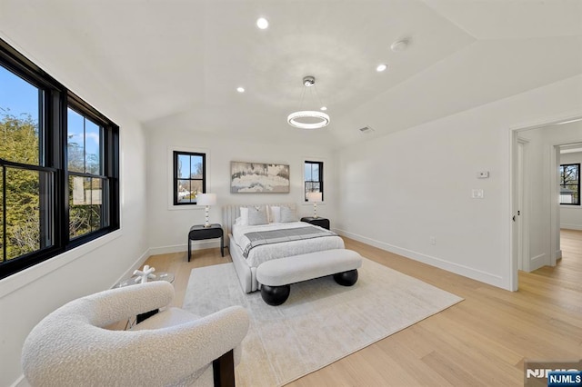 bedroom with recessed lighting, baseboards, light wood finished floors, and vaulted ceiling