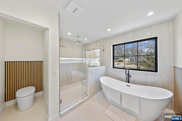 full bathroom featuring baseboards, recessed lighting, a stall shower, tile patterned floors, and a soaking tub