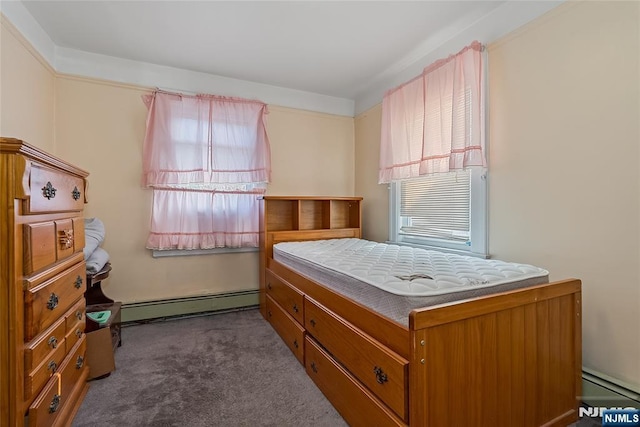 bedroom with carpet flooring, multiple windows, baseboard heating, and a baseboard heating unit