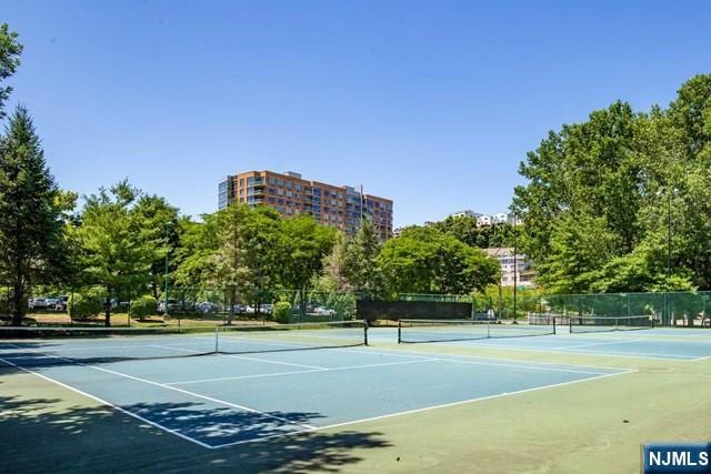 view of sport court with fence