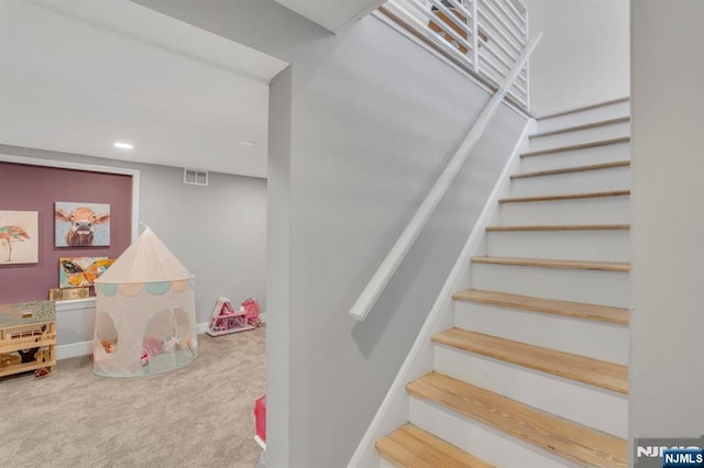 staircase with recessed lighting, visible vents, carpet floors, and baseboards