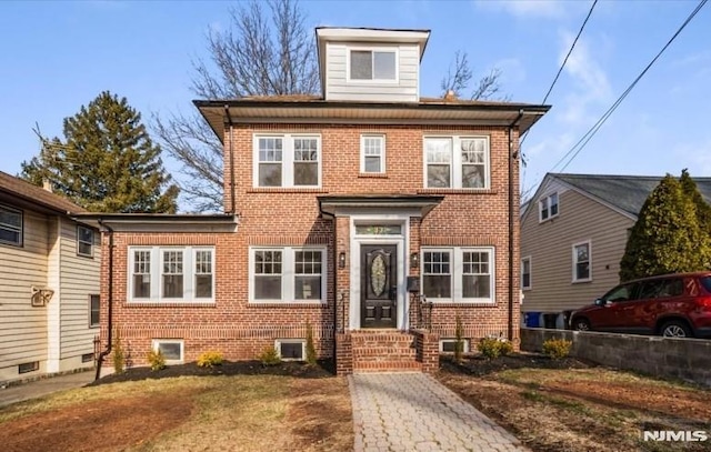 view of front of house featuring brick siding