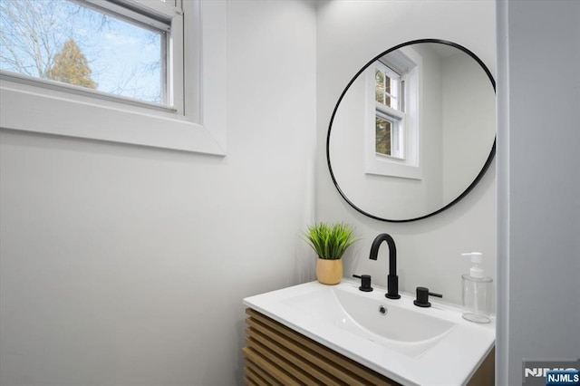 bathroom featuring plenty of natural light and vanity