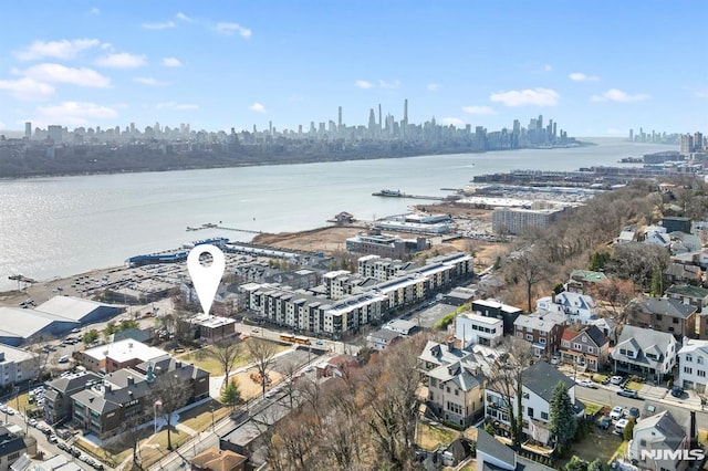 bird's eye view featuring a view of city and a water view