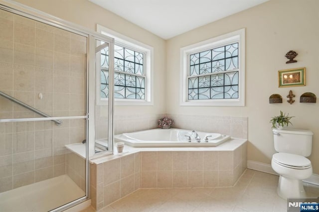 full bathroom with a garden tub, toilet, a shower stall, and tile patterned flooring