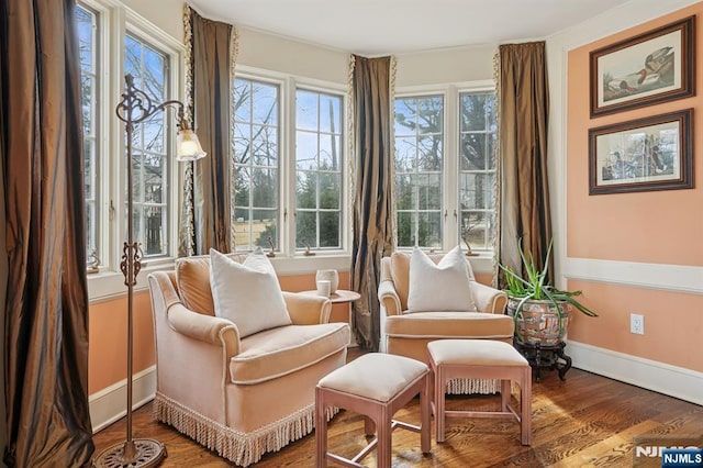 sitting room featuring baseboards and wood finished floors