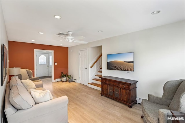 living area featuring stairs, light wood-style flooring, recessed lighting, and visible vents