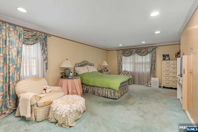 carpeted bedroom featuring recessed lighting and ornamental molding