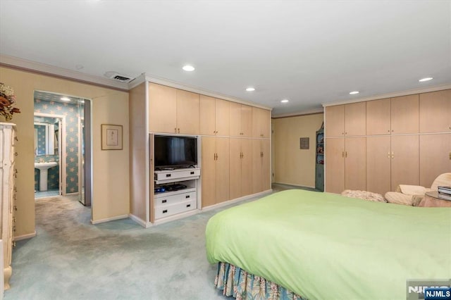 bedroom featuring baseboards, recessed lighting, a sink, light carpet, and crown molding