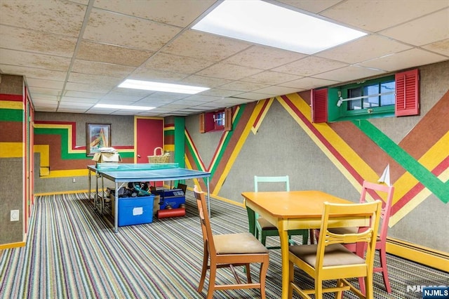 game room featuring wallpapered walls, carpet flooring, a paneled ceiling, and baseboards