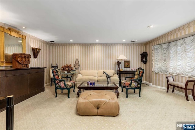 living area featuring light carpet, recessed lighting, and wallpapered walls