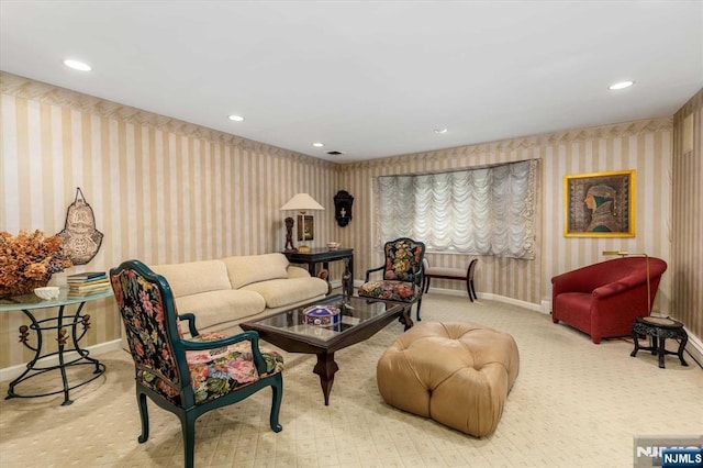 living room featuring recessed lighting, wallpapered walls, carpet, and baseboards