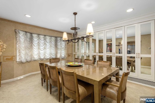 dining area featuring an inviting chandelier, recessed lighting, and light colored carpet