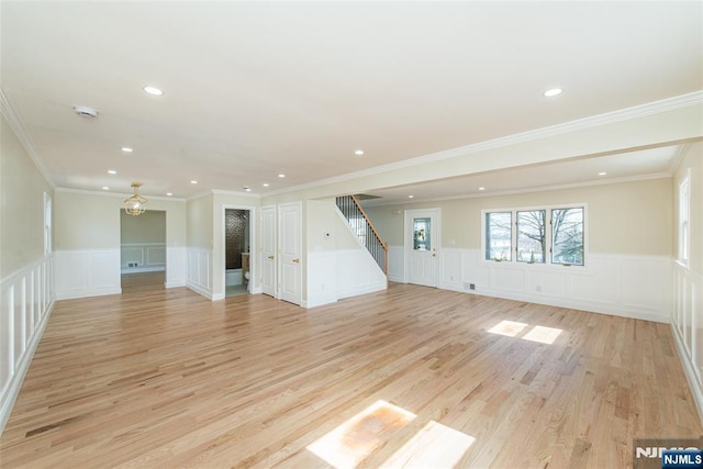 unfurnished living room featuring stairway, recessed lighting, and light wood-type flooring