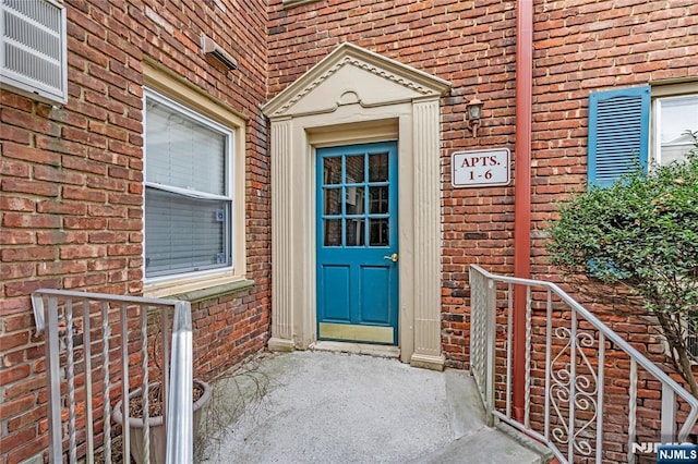 entrance to property with brick siding