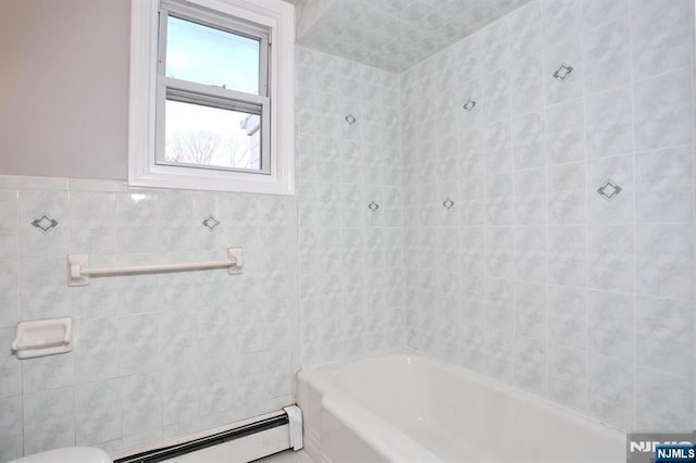 bathroom featuring toilet, tile walls, and a baseboard heating unit