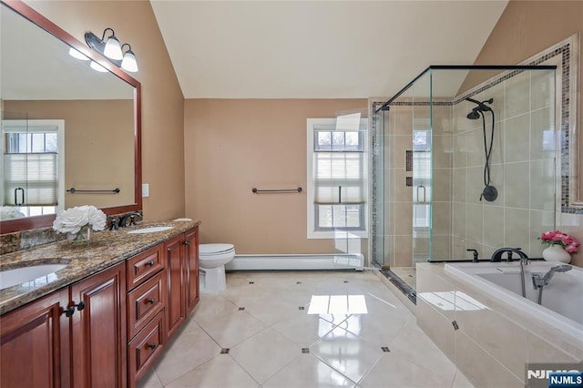 full bath with a stall shower, a sink, tile patterned flooring, baseboard heating, and vaulted ceiling