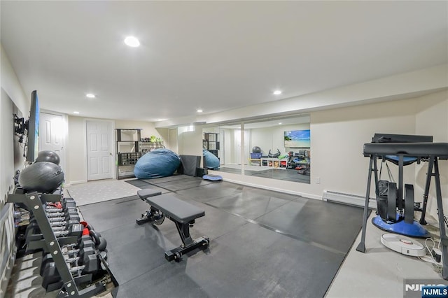 workout room with recessed lighting and a baseboard heating unit