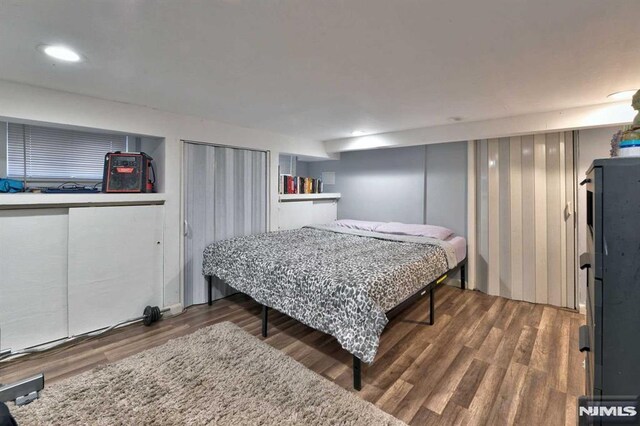 bedroom featuring wood finished floors