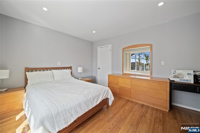 bedroom featuring recessed lighting and light wood finished floors