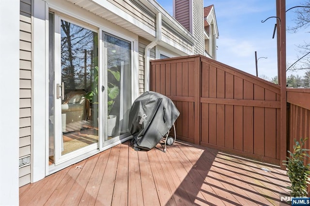 deck featuring fence and grilling area