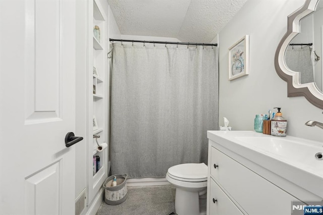 bathroom with a shower with shower curtain, a textured ceiling, vanity, and toilet