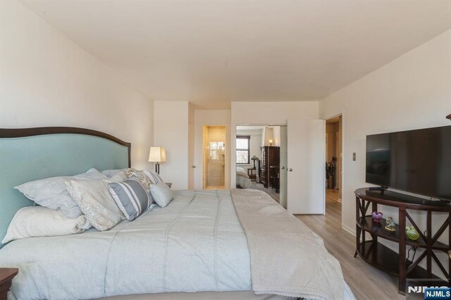 bedroom featuring wood finished floors